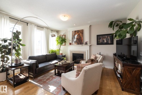5315 17 Avenue, Edmonton, AB - Indoor Photo Showing Living Room With Fireplace