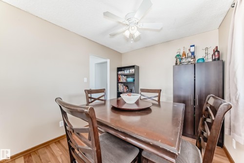 This room features wood flooring and a ceiling fan with integrated lighting - 11323 162 Avenue, Edmonton, AB - Indoor Photo Showing Dining Room