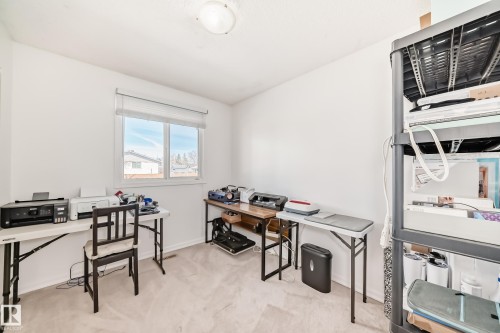 This room features light-colored carpeting, white walls, and a window providing natural light - 11323 162 Avenue, Edmonton, AB - Indoor Photo Showing Office