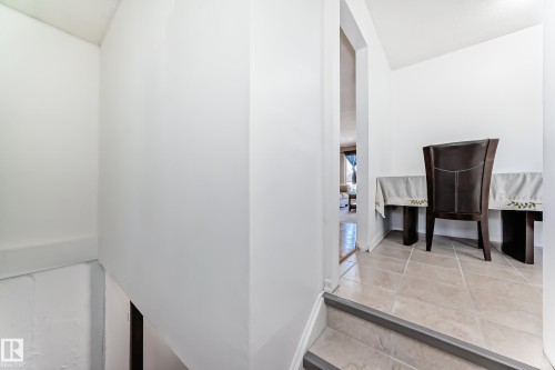 This area features light-colored tile flooring - 11323 162 Avenue, Edmonton, AB - Indoor Photo Showing Other Room