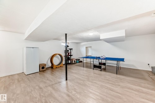Spacious finished basement featuring light-toned flooring, white walls, and a recessed ceiling light - 11323 162 Avenue, Edmonton, AB - Indoor Photo Showing Other Room