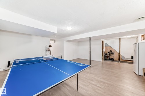 Spacious room with light-colored flooring and white walls, offering ample space for various uses - 11323 162 Avenue, Edmonton, AB - Indoor Photo Showing Other Room