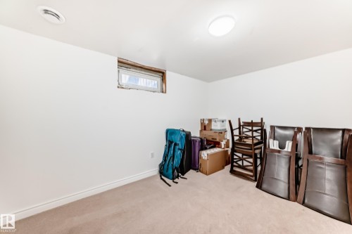 This room features white walls, a carpeted floor, and a window - 11323 162 Avenue, Edmonton, AB - Indoor Photo Showing Other Room