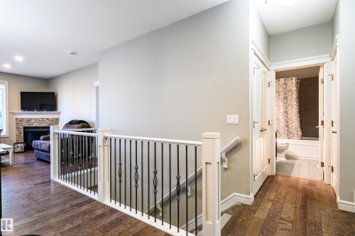 2 7115 Armour Link Link, Edmonton, AB - Indoor Photo Showing Other Room With Fireplace