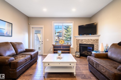 2 7115 Armour Link Link, Edmonton, AB - Indoor Photo Showing Living Room With Fireplace