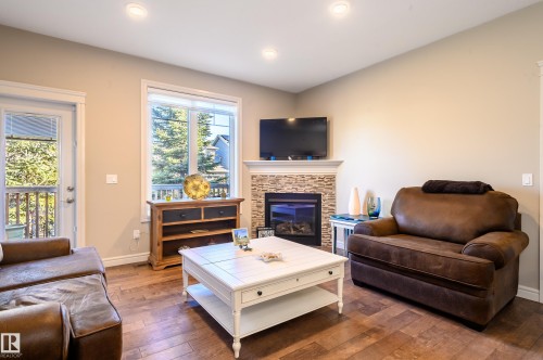 2 7115 Armour Link Link, Edmonton, AB - Indoor Photo Showing Living Room With Fireplace