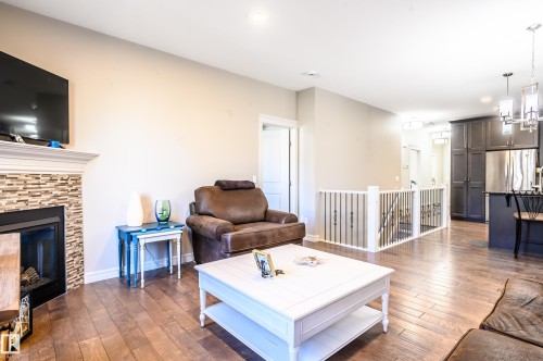 2 7115 Armour Link Link, Edmonton, AB - Indoor Photo Showing Living Room With Fireplace