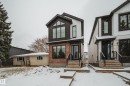 The property features a contemporary exterior with black siding and brick accents - 9536 148 Street, Edmonton, AB  - Outdoor With Facade 