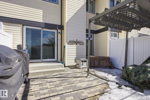 The property features a private patio with a paver stone surface - 3237 142 Avenue, Edmonton, AB - Outdoor With Exterior
