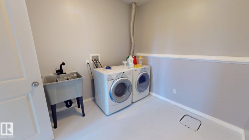 8001 First Street, Fort Saskatchewan, AB - Indoor Photo Showing Laundry Room