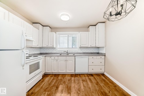 6 Woodvale Village, Edmonton, AB - Indoor Photo Showing Kitchen With Double Sink