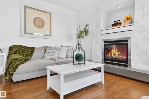 1004 Secord Promenade, Edmonton, AB - Indoor Photo Showing Living Room With Fireplace
