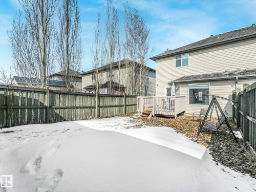 The property features a fenced yard with a deck and a siding exterior - 675 Mcallister Loop, Edmonton, AB - Outdoor
