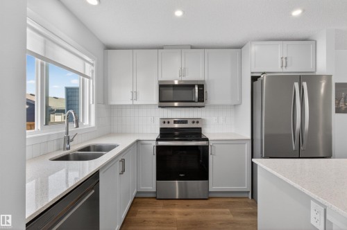2422 Trumpeter Way, Edmonton, AB - Indoor Photo Showing Kitchen With Double Sink