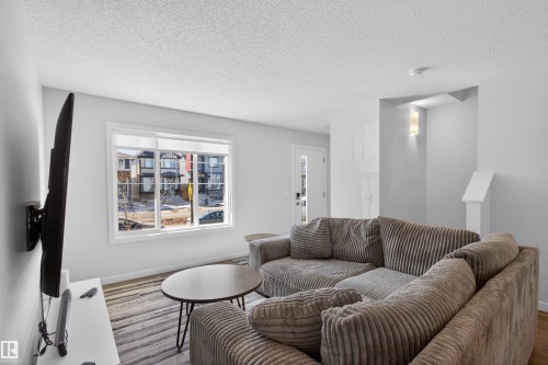 2422 Trumpeter Way, Edmonton, AB - Indoor Photo Showing Living Room