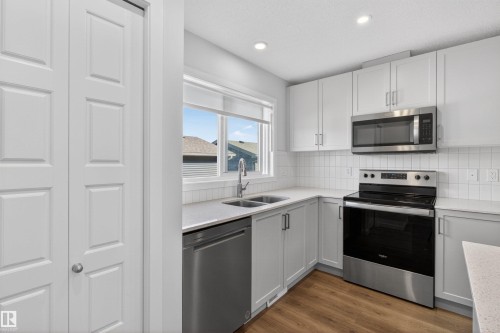 2422 Trumpeter Way, Edmonton, AB - Indoor Photo Showing Kitchen With Double Sink
