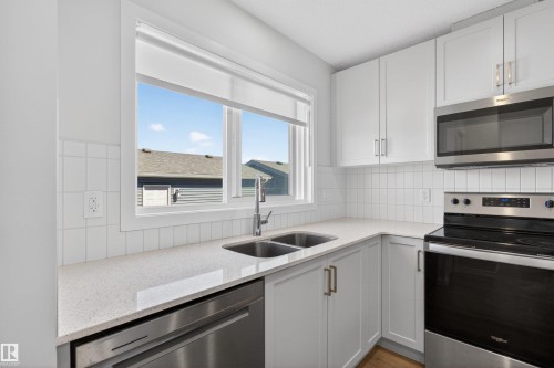 2422 Trumpeter Way, Edmonton, AB - Indoor Photo Showing Kitchen With Double Sink