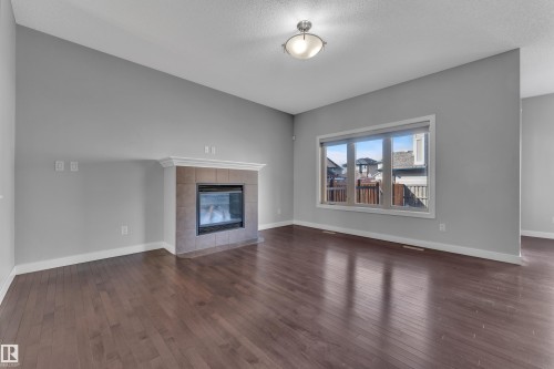 642 Adams Way, Edmonton, AB - Indoor Photo Showing Living Room With Fireplace