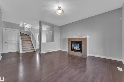 642 Adams Way, Edmonton, AB - Indoor Photo Showing Living Room With Fireplace