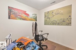 Room with light-colored walls and wood flooring - 