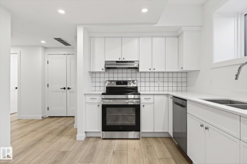 9705 68 Avenue, Edmonton, AB - Indoor Photo Showing Kitchen With Double Sink