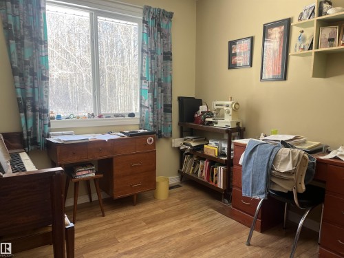 This room features durable wood-look flooring and a window providing natural light - 55131 Range Road 83, Rural Yellowhead, AB - Indoor