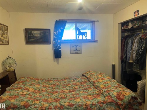 This room features a window with natural light and a built-in closet - 55131 Range Road 83, Rural Yellowhead, AB - Indoor Photo Showing Bedroom