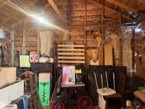 The property features exposed wooden beams and plank walls - 55131 Range Road 83, Rural Yellowhead, AB - Indoor Photo Showing Other Room