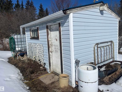 Exterior shed with light blue siding and a white trim - 55131 Range Road 83, Rural Yellowhead, AB - Outdoor