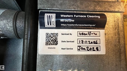 A white service label from "Western Furnace Cleaning" is displayed on a metallic surface, indicating a recent service date of 17.01.2026 and a scheduled next service for January 2028 - 3323 107 Avenue Nw, Edmonton, AB - Other