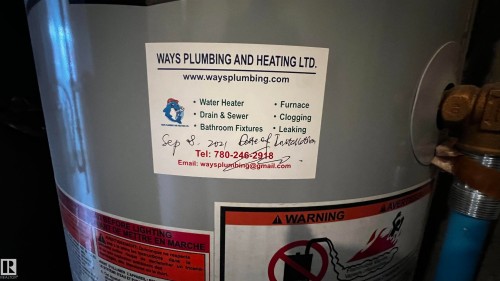 The property includes a water heater with a visible installation date of September 8, 2021 - 3323 107 Avenue Nw, Edmonton, AB - Indoor Photo Showing Basement