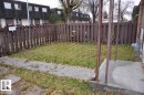 The property features a fenced yard with a lawn and a concrete walkway - 3323 107 Avenue Nw, Edmonton, AB  - Outdoor 