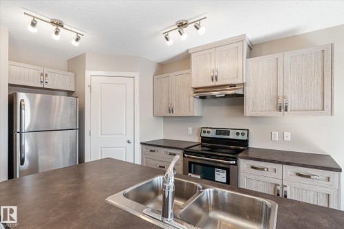 3217 11 Avenue, Edmonton, AB - Indoor Photo Showing Kitchen With Double Sink