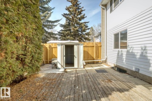 The property includes a wooden deck and a side patio with a storage shed - 95 Ridgewood Terrace, St. Albert, AB - Outdoor