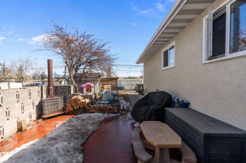 The property features a stucco exterior with white-trimmed windows and white eaves - 28 Camelot Avenue, Leduc, AB - Outdoor