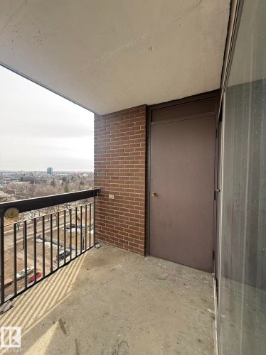 Outdoor balcony with a brick exterior wall and a metal railing - 1004 11027 87 Avenue, Edmonton, AB - Outdoor With Balcony With Exterior
