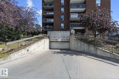 The property features an underground parking garage with a paved entrance ramp - 1004 11027 87 Avenue, Edmonton, AB - Outdoor With Balcony