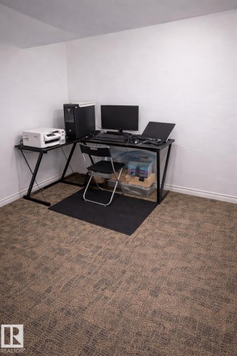 This room features textured carpet flooring and white walls - 844 Erin Place, Edmonton, AB - Indoor Photo Showing Office