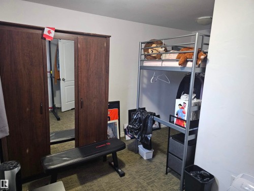 This room features light-colored walls and carpet flooring - 844 Erin Place, Edmonton, AB - Indoor