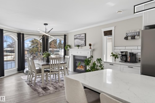807 Beach Avenue, Cold Lake, AB - Indoor Photo Showing Dining Room With Fireplace
