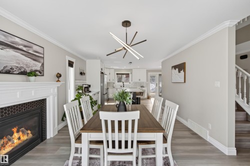 807 Beach Avenue, Cold Lake, AB - Indoor Photo Showing Dining Room With Fireplace