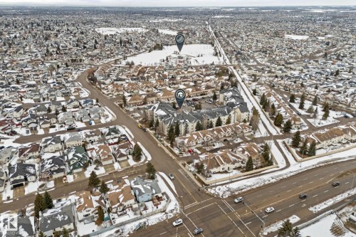 Aerial view showcasing the residential area with a mix of single-unit and multi-unit properties - 208 6710 158 Avenue, Edmonton, AB - 