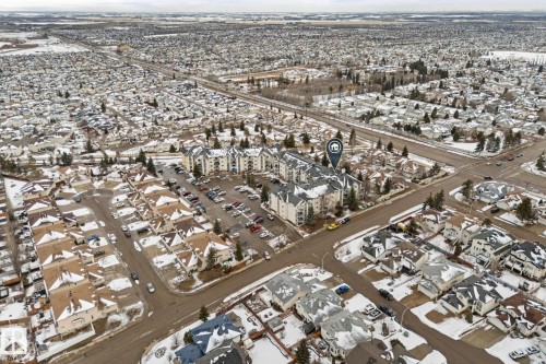 Aerial view showcasing the property's location within a residential area, surrounded by similar-style residences - 208 6710 158 Avenue, Edmonton, AB -  With View