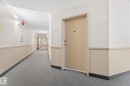 Entryway featuring a solid door, neutral wall tones, and carpeted flooring - 208 6710 158 Avenue, Edmonton, AB  - Indoor Photo Showing Other Room 