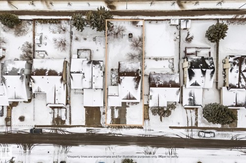 Aerial view of the property and its surrounding area, featuring snow-covered rooftops and grounds - 7252 152C Avenue, Edmonton, AB - Other