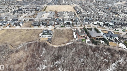 Aerial view showcasing a residential area with a mix of established homes and undeveloped land parcels - 24 Windermere Drive, Edmonton, AB 