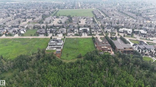 Aerial perspective showcasing a developed residential area with expansive green spaces - 24 Windermere Drive Sw, Edmonton, AB 