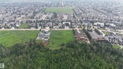Aerial perspective showcasing a developed residential area with expansive green spaces - 