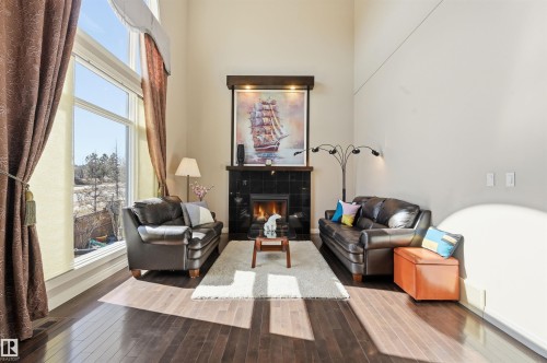 831 Hollands Landing, Edmonton, AB - Indoor Photo Showing Other Room With Fireplace