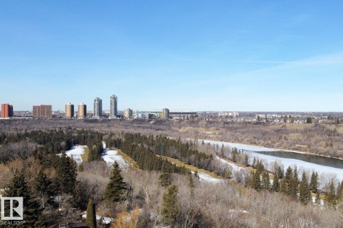 Enjoy expansive views of the city skyline, a river with partially frozen water, and extensive natural areas featuring coniferous and deciduous trees - 10612 79 Street, Edmonton, AB - Outdoor With View
